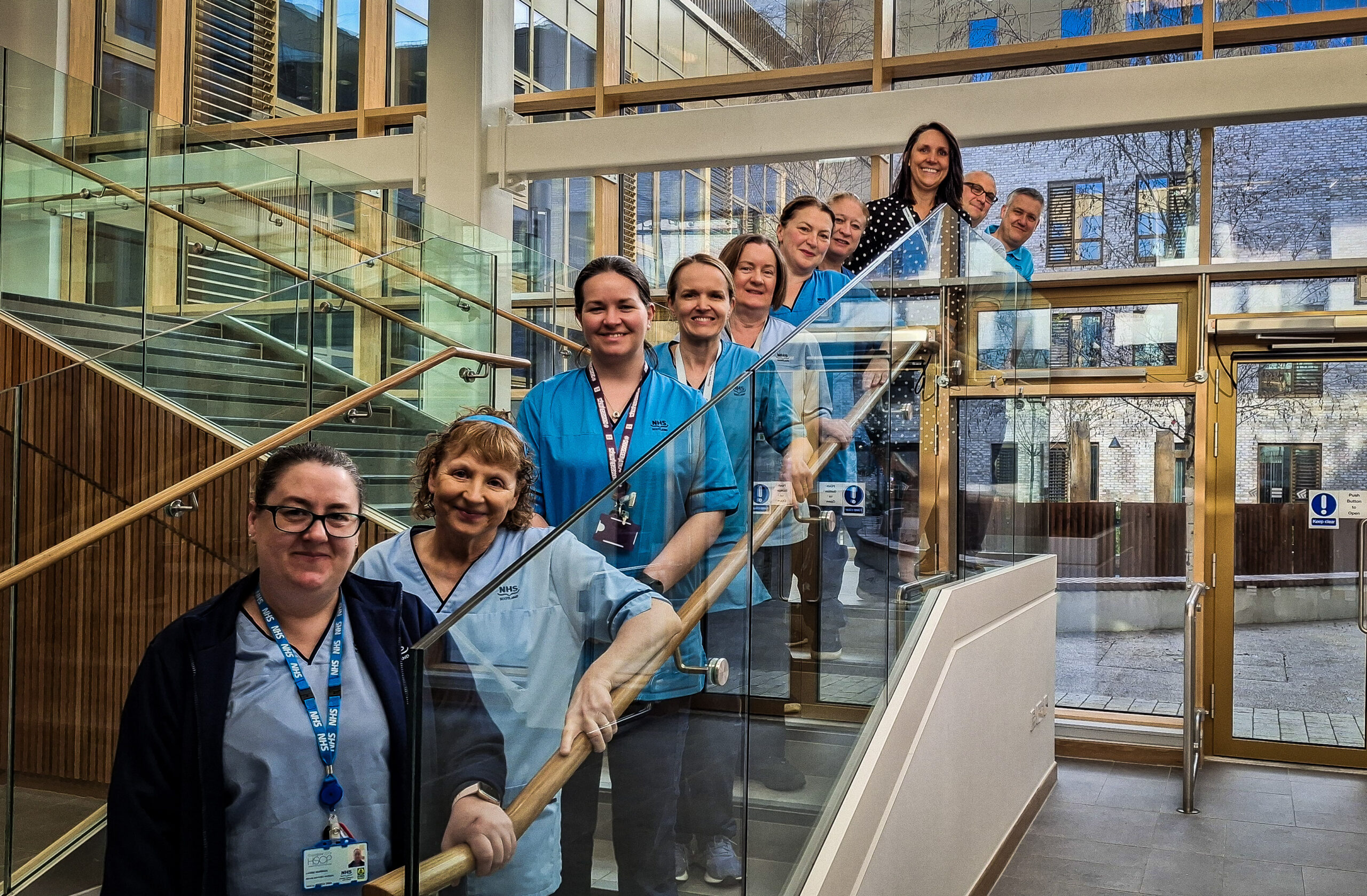 Members of the North-East Glasgow Rehab Team on stairs at the new Parkhead Hub