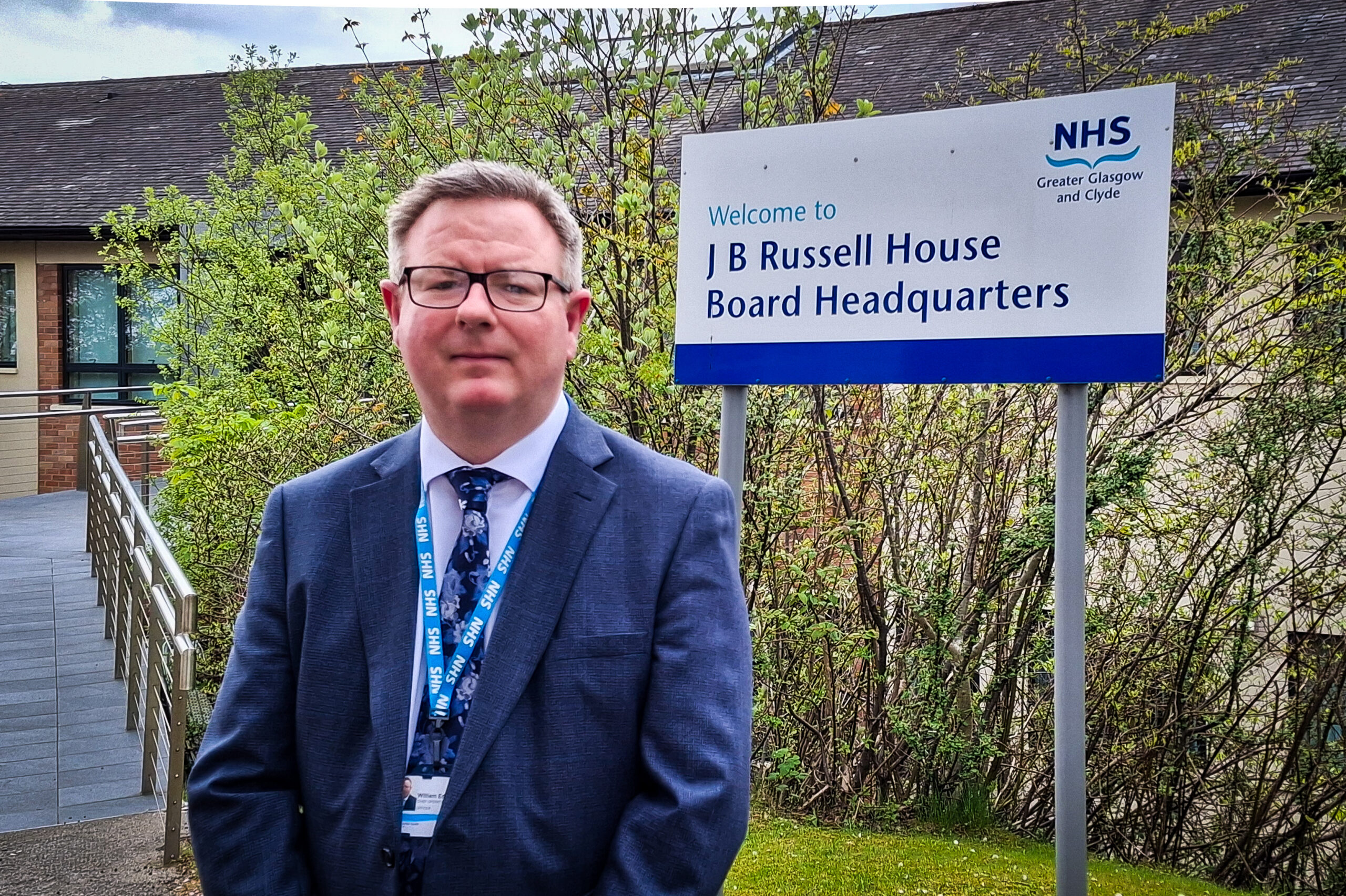 William Edwards, Deputy Chief Executive of NHS Greater Glasgow and Clyde, standing outsite the Board's headquarters