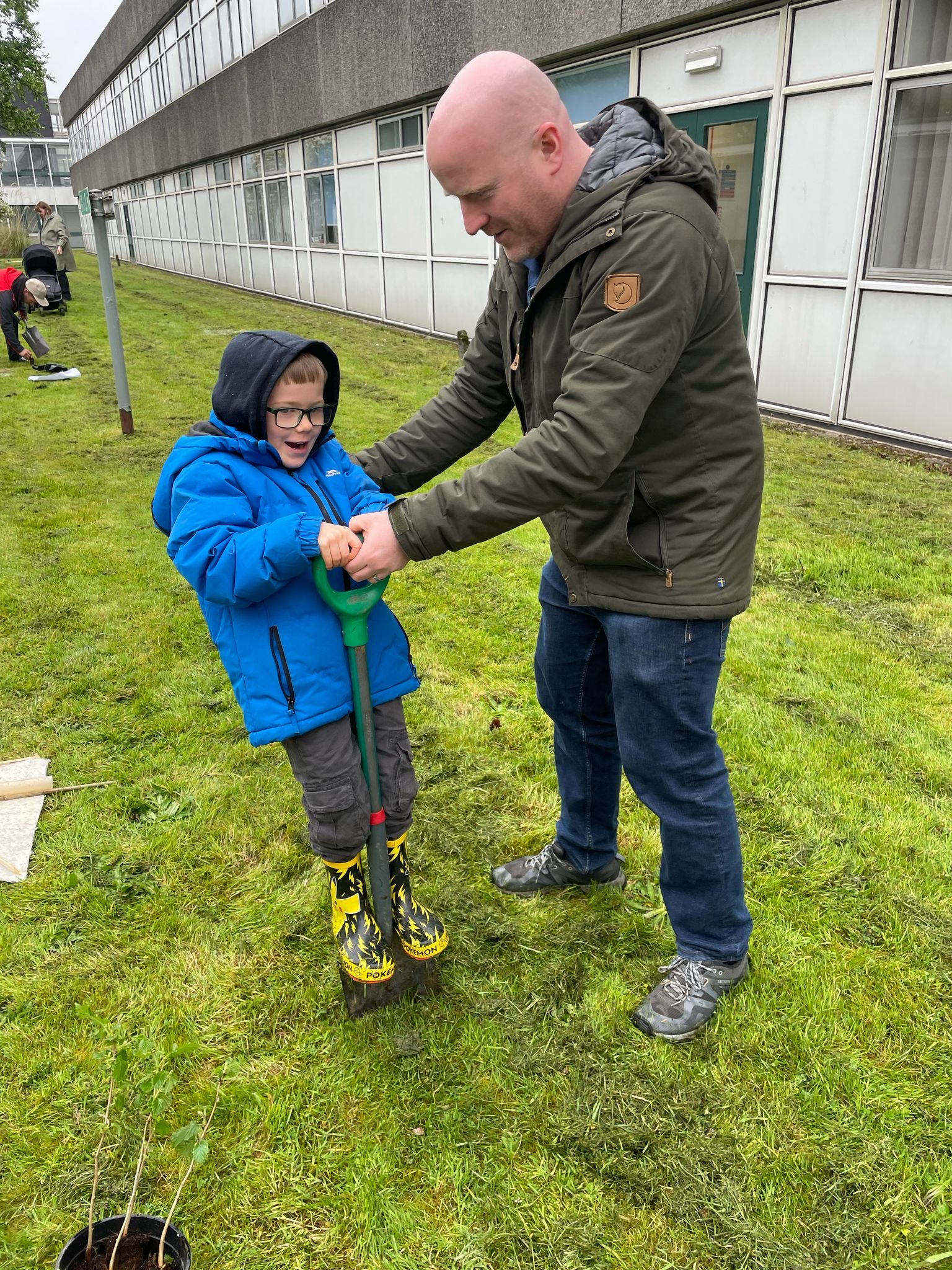 Birthday boy Tommy MacDonald, plants a tree to celebrate turning seven.