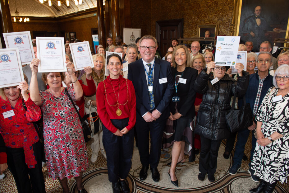 Deputy Lord Provost Christy Mearns, Deputy Chief Executive William Edwards and Strategic Lead for Volunteering Fiona Smith with some of the guests at the civic reception.