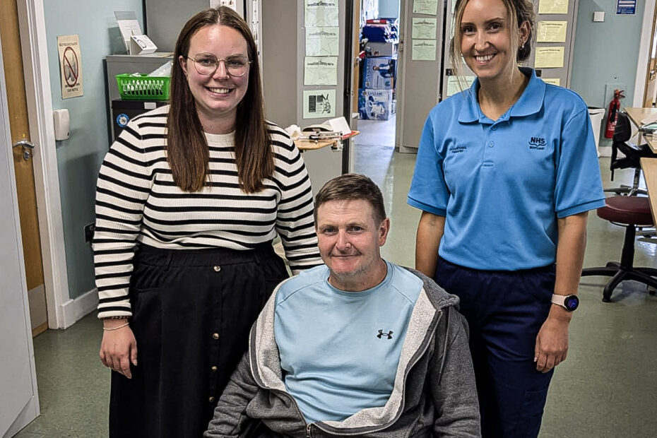 Eve Young of Housing Options Scotland, patient Allan Campbell and Specialist Occupational Therapist Jennifer Cloughley pose for a picture in one of the Spinal Injuries Unit's rehab rooms.