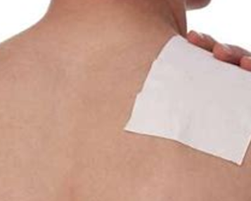 Patient's bare back with lidocaine patch attached