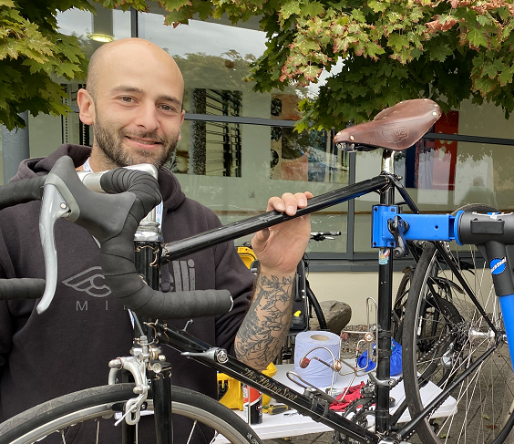 Claudio Pia works on a bike during on of his Dr Bike sessions.
