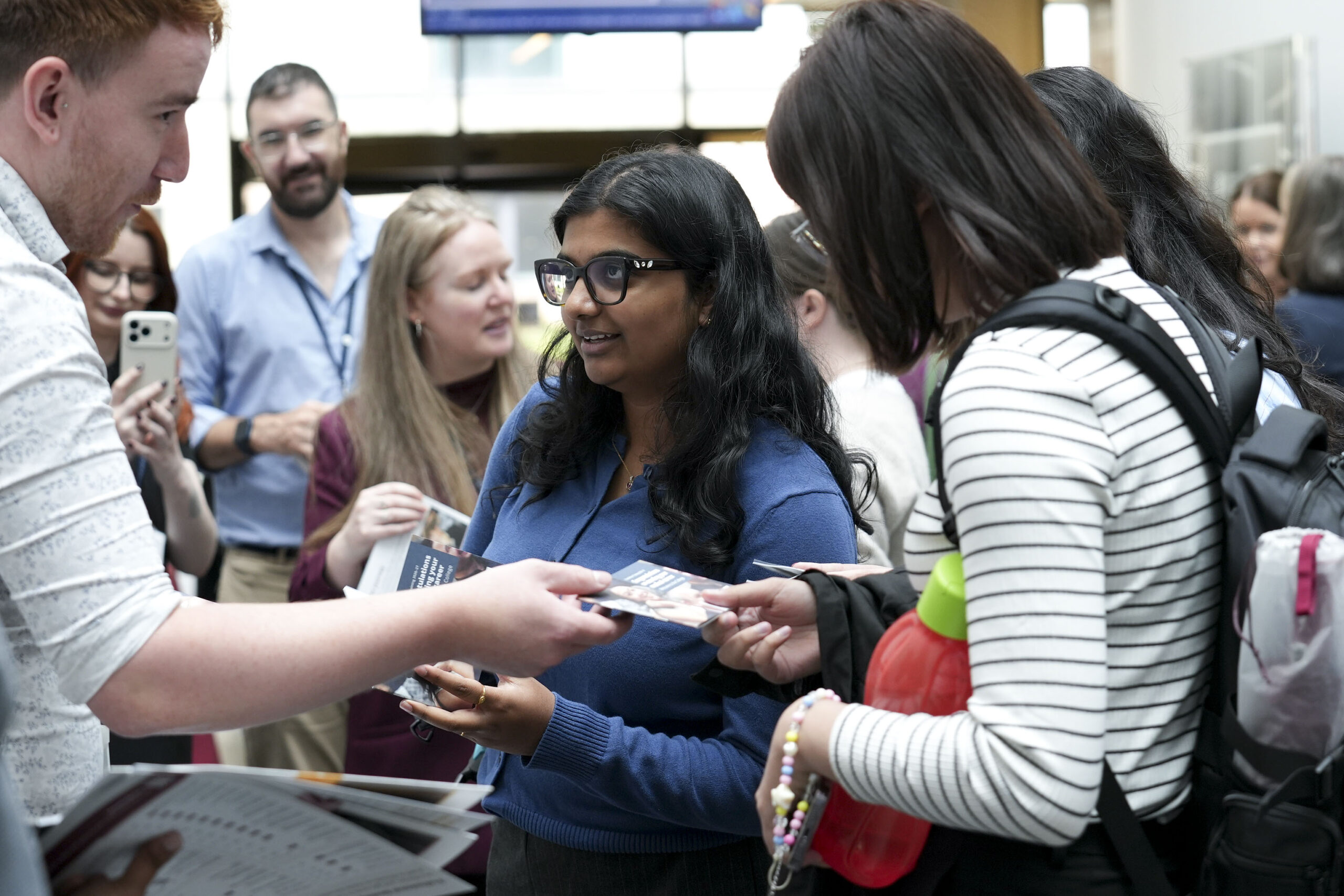 A young woman chats to one of the stall-holders at the FY1 event