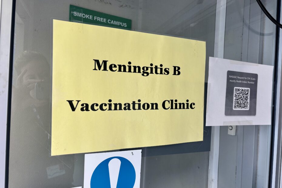 Yellow sign on door saying simply: "Meningitis B Vaccination Clinic"