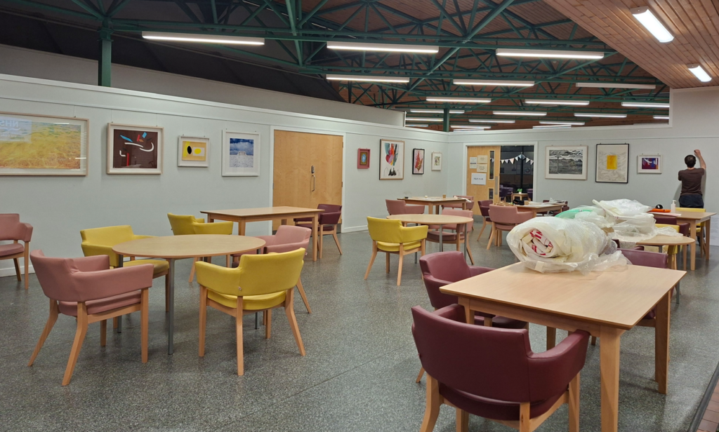 Artworks being installed in the dining room at the Royal Alexandra Hospital.
